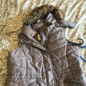 grey vest with fur lining on hood